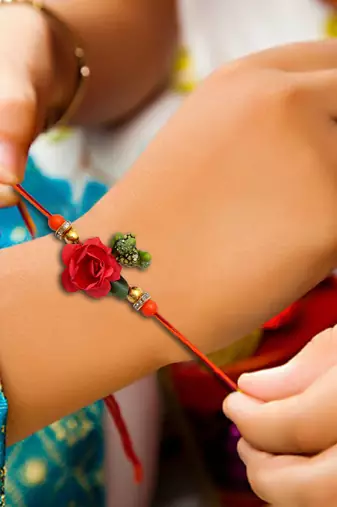Handcrafted pearl & gold bead rakhi