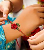 Handcrafted pearl & gold bead rakhi