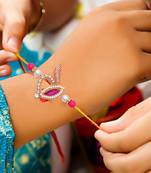 Handcrafted pearl & gold bead rakhi