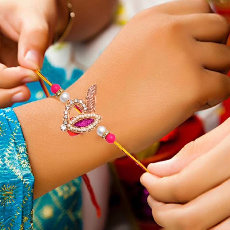 Handcrafted pearl & gold bead rakhi