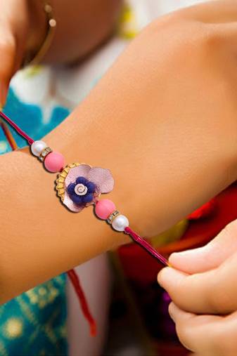 Handcrafted pearl & gold bead rakhi