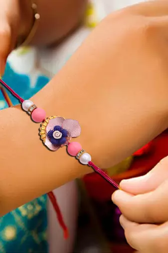 Handcrafted pearl & gold bead rakhi