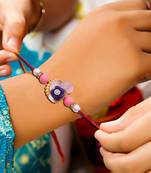 Handcrafted pearl & gold bead rakhi