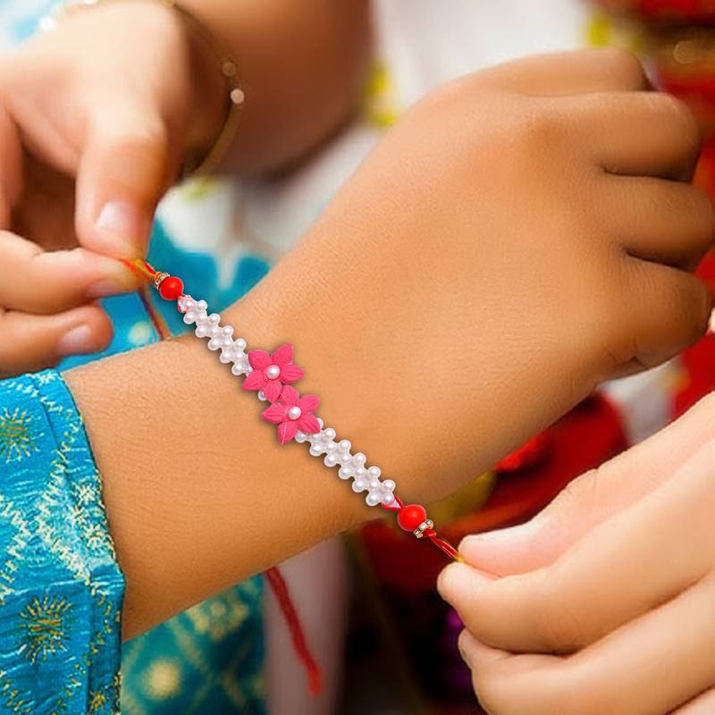 Handcrafted pearl & gold bead rakhi