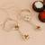 Handcrafted pearl & gold bead rakhi