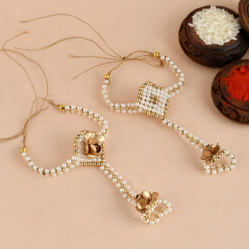 Handcrafted pearl & gold bead rakhi
