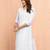Women's white cotton chikankari kurta - traditional raksha bandhan outfit with paisley embroidery