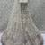 Off White Net Heavy Fancy Embroidered Designer Lehenga Choli