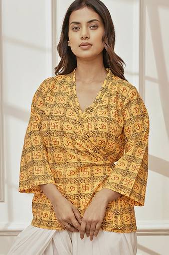 Women's yellow printed cotton wrap around yoga top with ethnic motifs & shawl collar