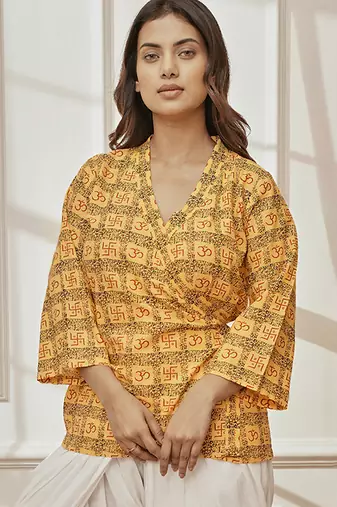 Women's yellow printed cotton wrap around yoga top with ethnic motifs & shawl collar
