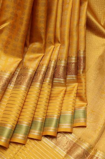 Mustard yellow and gold pure zari silk saree