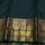 Deep green and gold pure zari silk saree