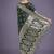 dark green banarasi satin silk saree with intricate zari weaving pattern