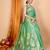 green banarasi silk blend meenakari zari weaving saree with tassels on pallu
