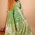 green banarasi silk blend meenakari zari weaving saree with tassels on pallu