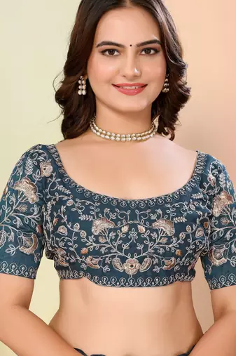 Teal blue organza embroidered saree