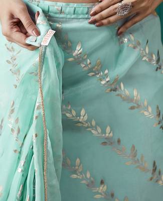 pre draped sea green organza foil printed saree 4
