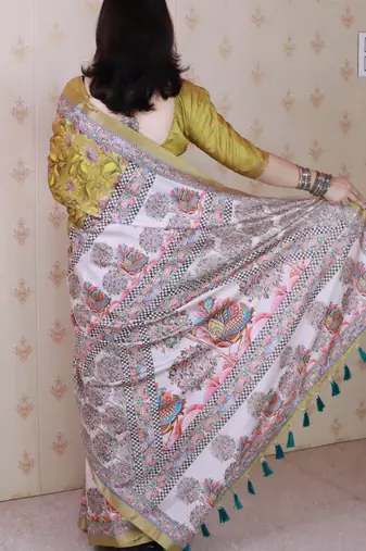Woven zari border digital printed yellow tussar silk blend saree
