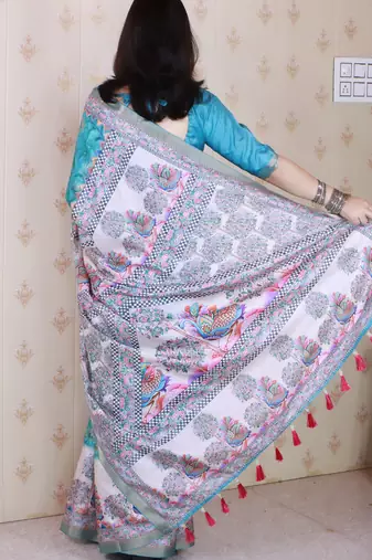 Woven zari border digital printed sea green tussar silk blend saree