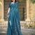 Teal printed saree with woven border