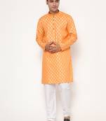 Men's festive orange printed kurta with white churidar
