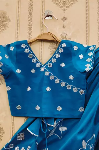 Turquoise embroidered taffeta lehenga and choli for girls