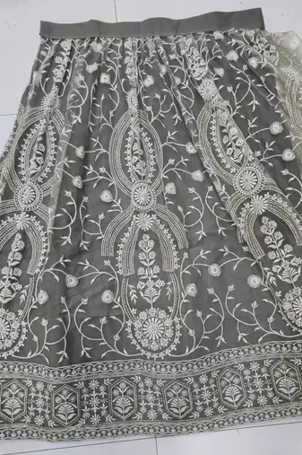 IVORY NET FABRIC LEHENGA WITH SEQUINS AND THREAD EMBROIDERY WORK