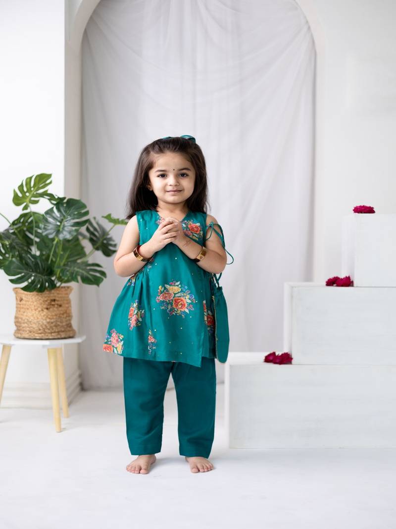 Green printed cotton kurta set with hair clip & potli bag.
