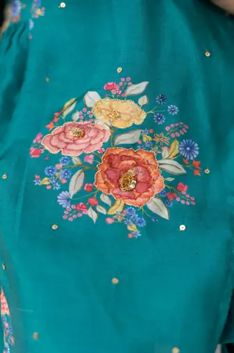 Green printed cotton kurta set with hair clip & potli bag.