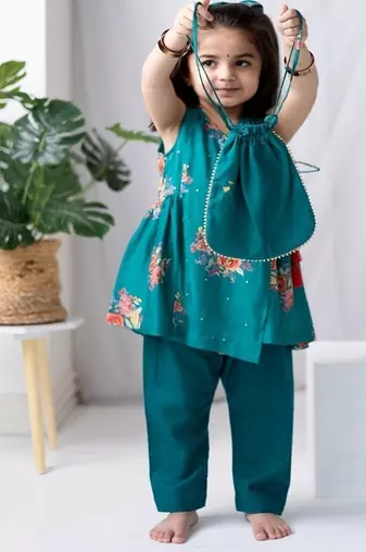 Green printed cotton kurta set with hair clip & potli bag.
