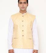 yellow nehru jacket with golden floral motif accents.