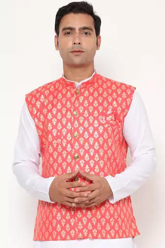 Elegant peach nehru jacket with golden floral motif accents.