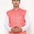 Elegant peach nehru jacket with golden floral motif accents.