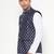 Elegant navy blue nehru jacket with golden floral motif accents.