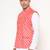 Elegant peach nehru jacket with golden floral motif accents.