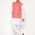 Elegant peach nehru jacket with golden floral motif accents.