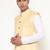 Elegant yellow nehru jacket with golden floral motif accents.