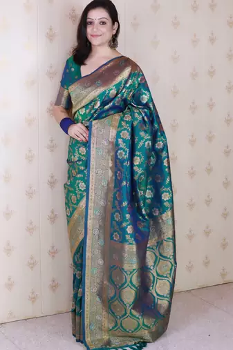 green banarasi jaal silk blend gold zari meenakari woven saree