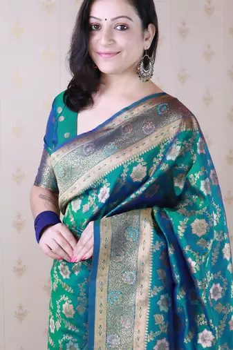 green banarasi jaal silk blend gold zari meenakari woven saree
