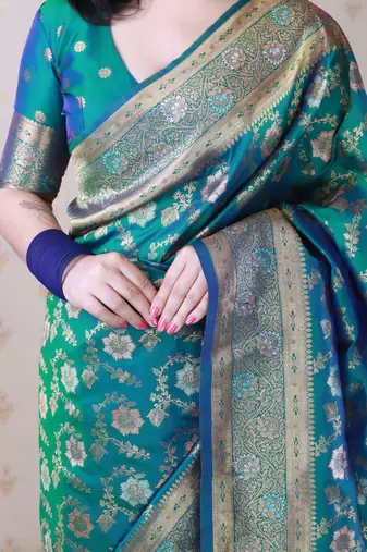 green banarasi jaal silk blend gold zari meenakari woven saree