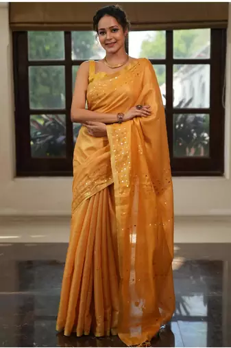 Mustard orange handwoven tissue linen saree with mirror work