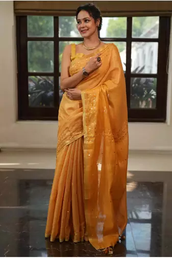 Mustard orange handwoven tissue linen saree with mirror work