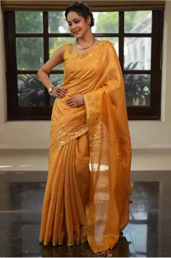 Mustard orange handwoven tissue linen saree with mirror work