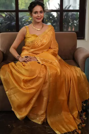Mustard orange handwoven tissue linen saree with mirror work