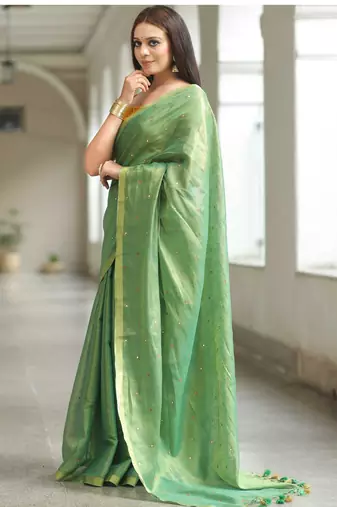 handwoven green tissue linen saree with mirror work