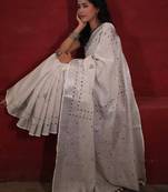 handwoven white linen saree with mirror work