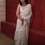 handwoven white linen saree with mirror work