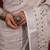 handwoven white linen saree with mirror work