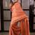 Orange handwoven tissue linen saree with mirror work