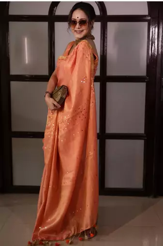Orange handwoven tissue linen saree with mirror work